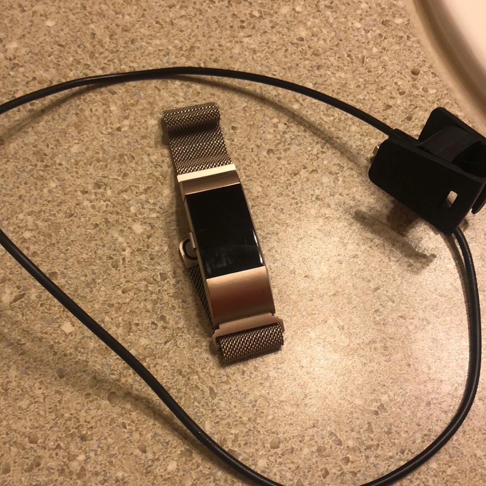 Fitbit Charge 2 with charger.